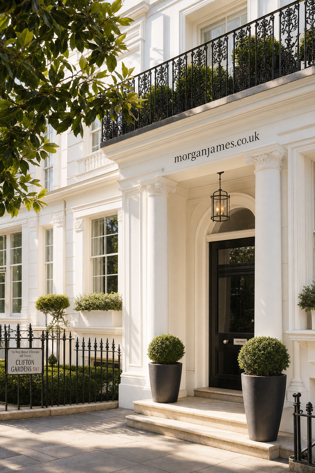Sophisticated white townhouse entrance with black door, classical columns, ornamental planting in tall planters and a Clifton Gardens street sign in a prestigious London neighborhood.